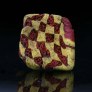 Ancient mosaic glass bead with checkerboard yellow and red pattern